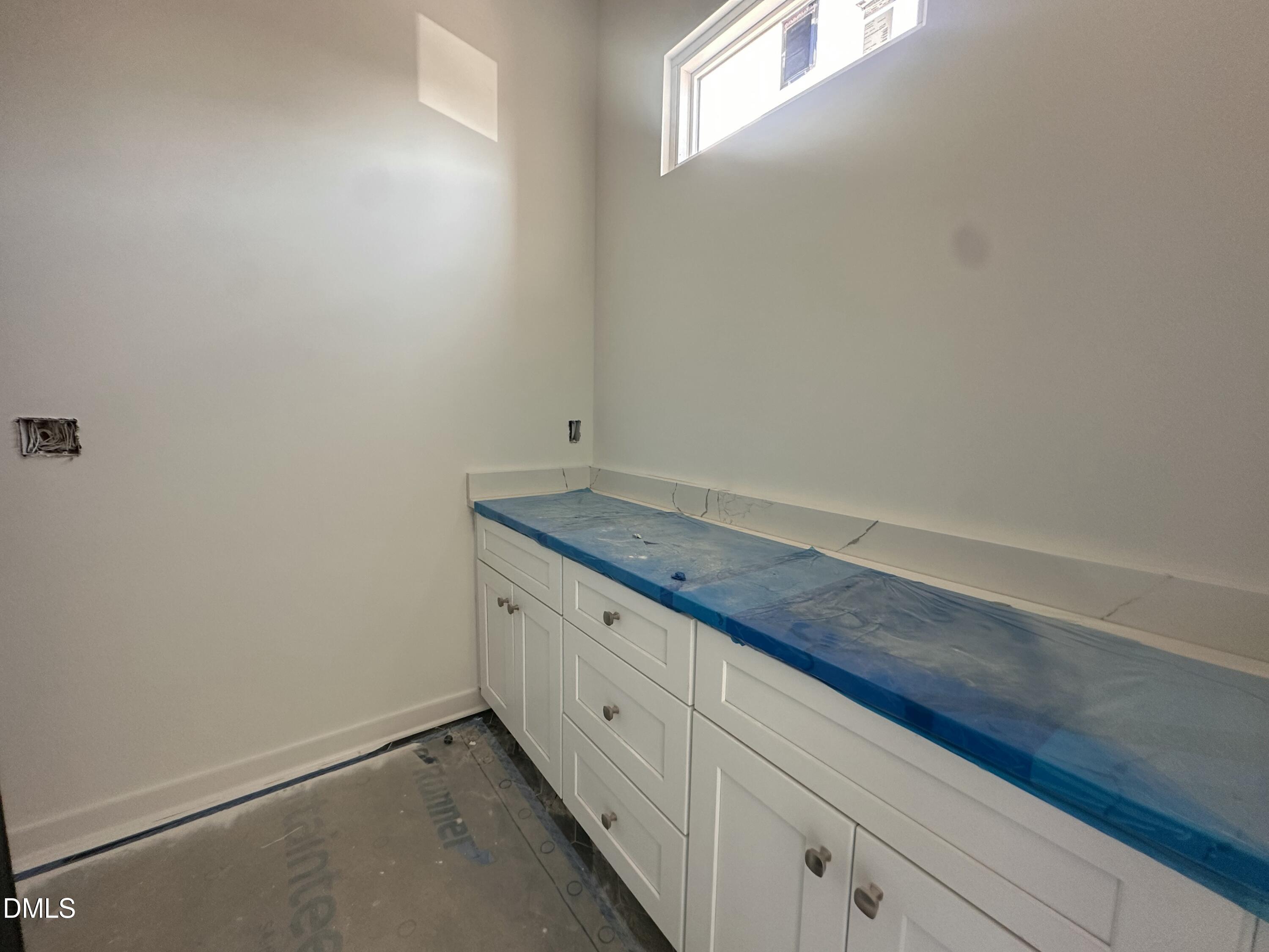 1521 Sunrise Avenue Raleigh, NC 27608 - Photo 14 of 19 a view of storage and utility room with window