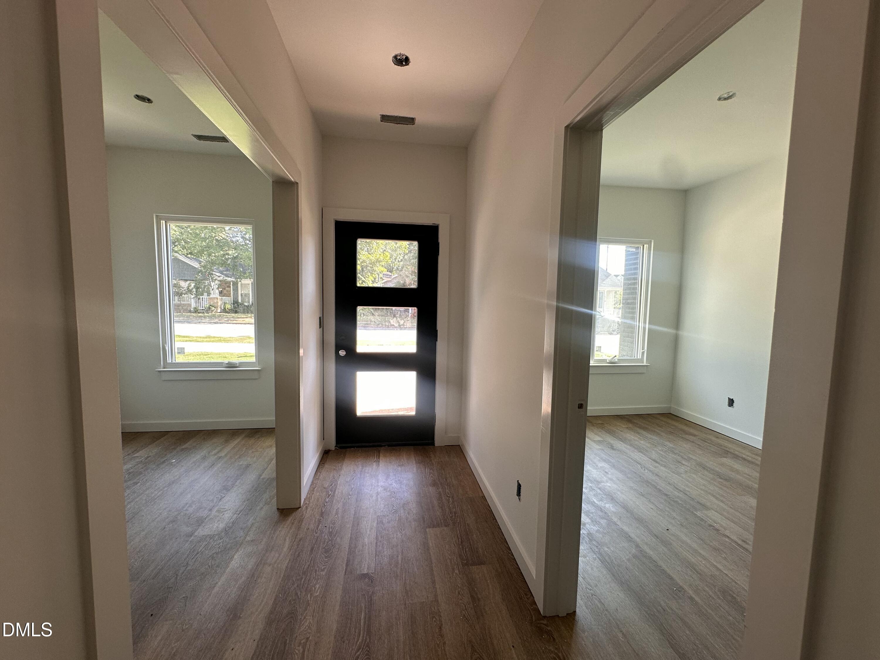 1521 Sunrise Avenue Raleigh, NC 27608 - Photo 2 of 19 wooden floor in an empty room with a window