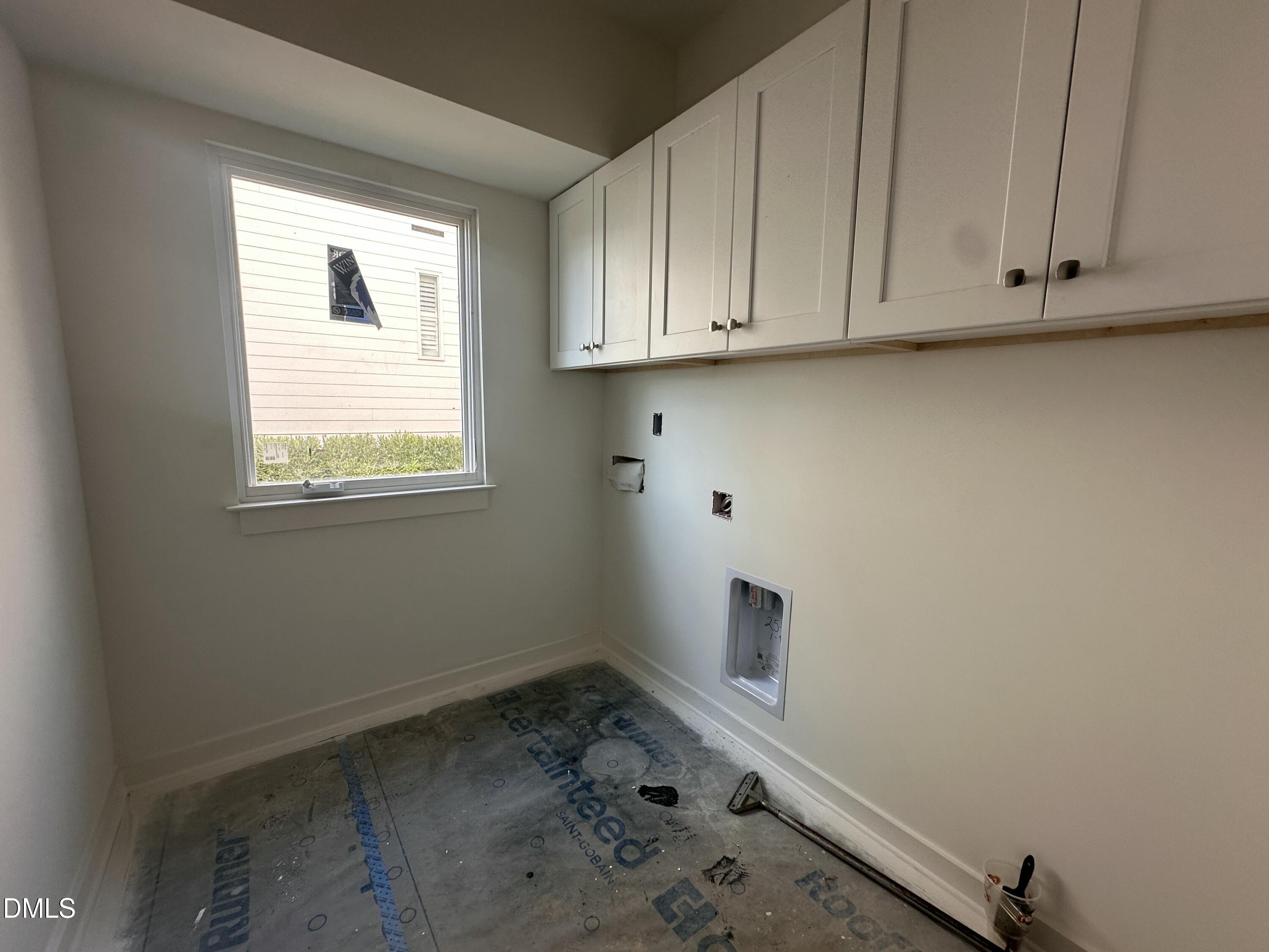 1521 Sunrise Avenue Raleigh, NC 27608 - Photo 6 of 19 a room with a window and cabinet