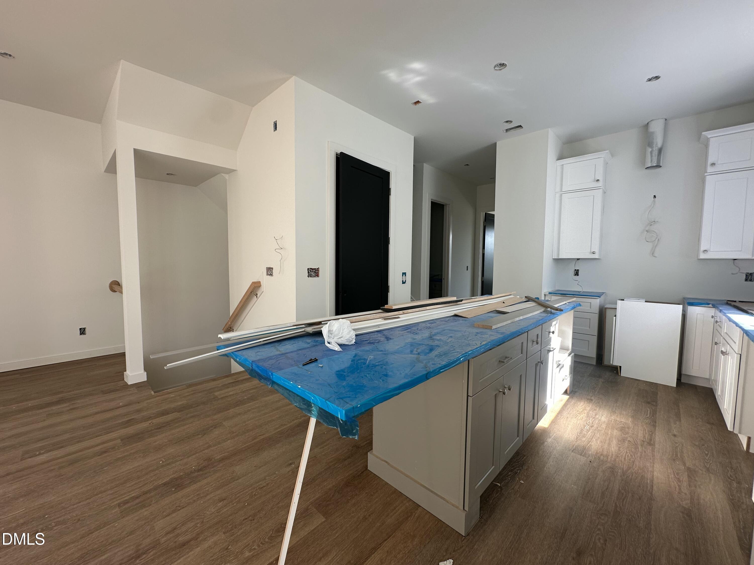 1521 Sunrise Avenue Raleigh, NC 27608 - Photo 10 of 19 a kitchen with stainless steel appliances granite countertop a sink stove and wooden floor