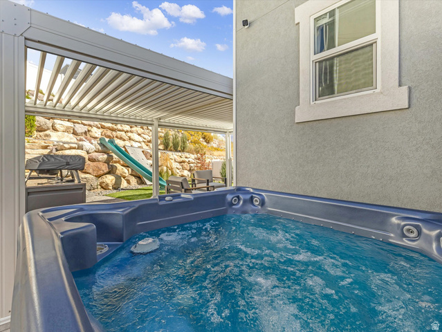 882 Spring Dew Lane Lehi, UT 84048 - Photo 18 of 46 View of pool with a hot tub