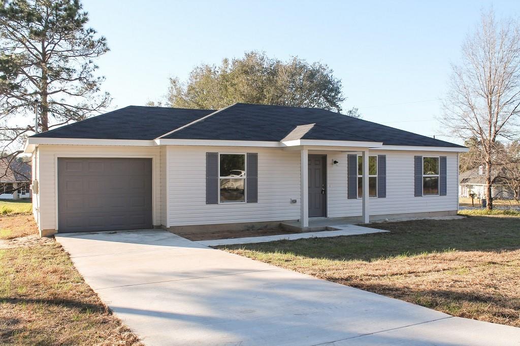 Tbd Locust Loop Ocala, FL 34472 - Photo 1 of 1 a front view of a house with a yard