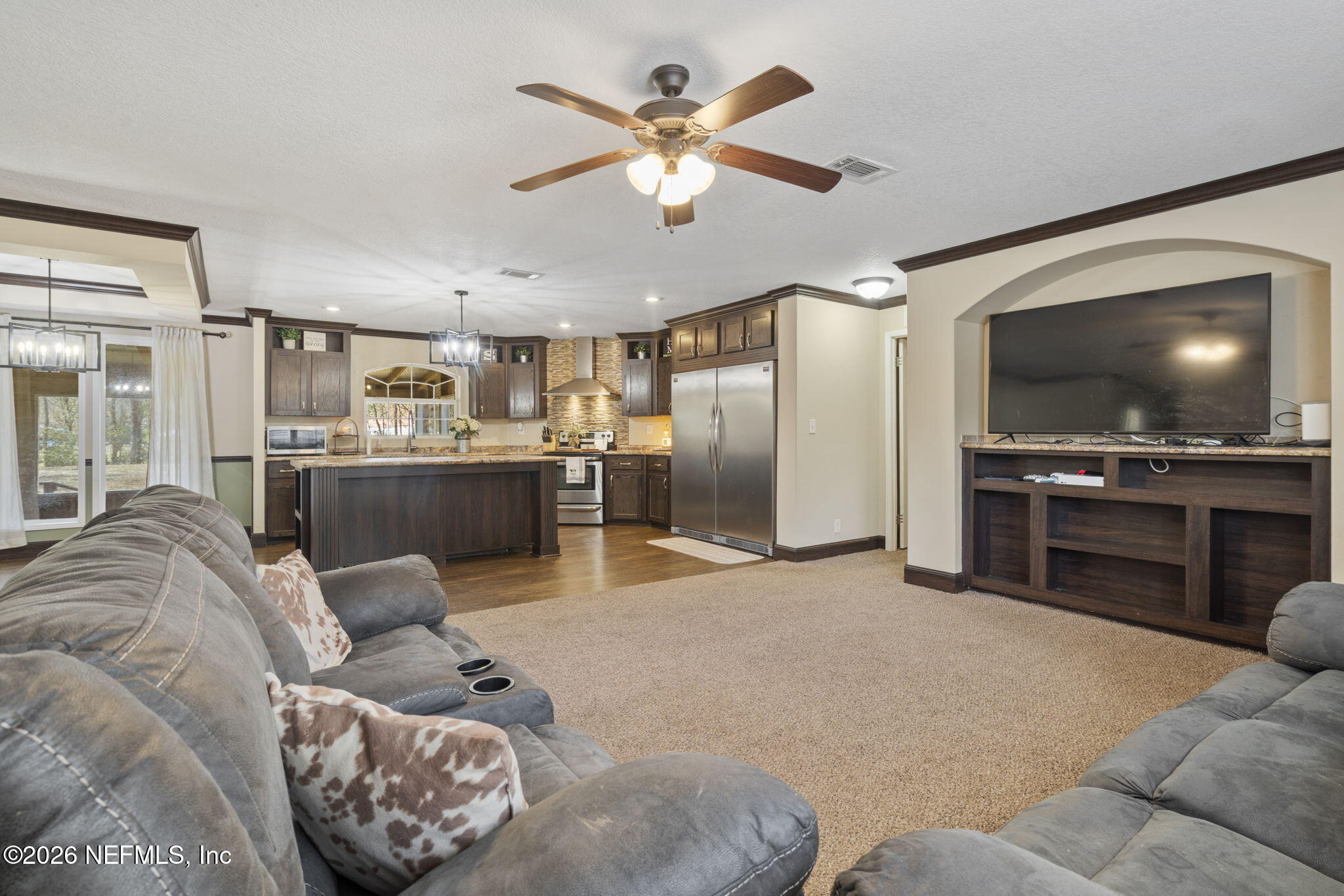 540605 Lem Turner Road Callahan, FL 32011 - Photo 16 of 31 a living room with furniture and kitchen view