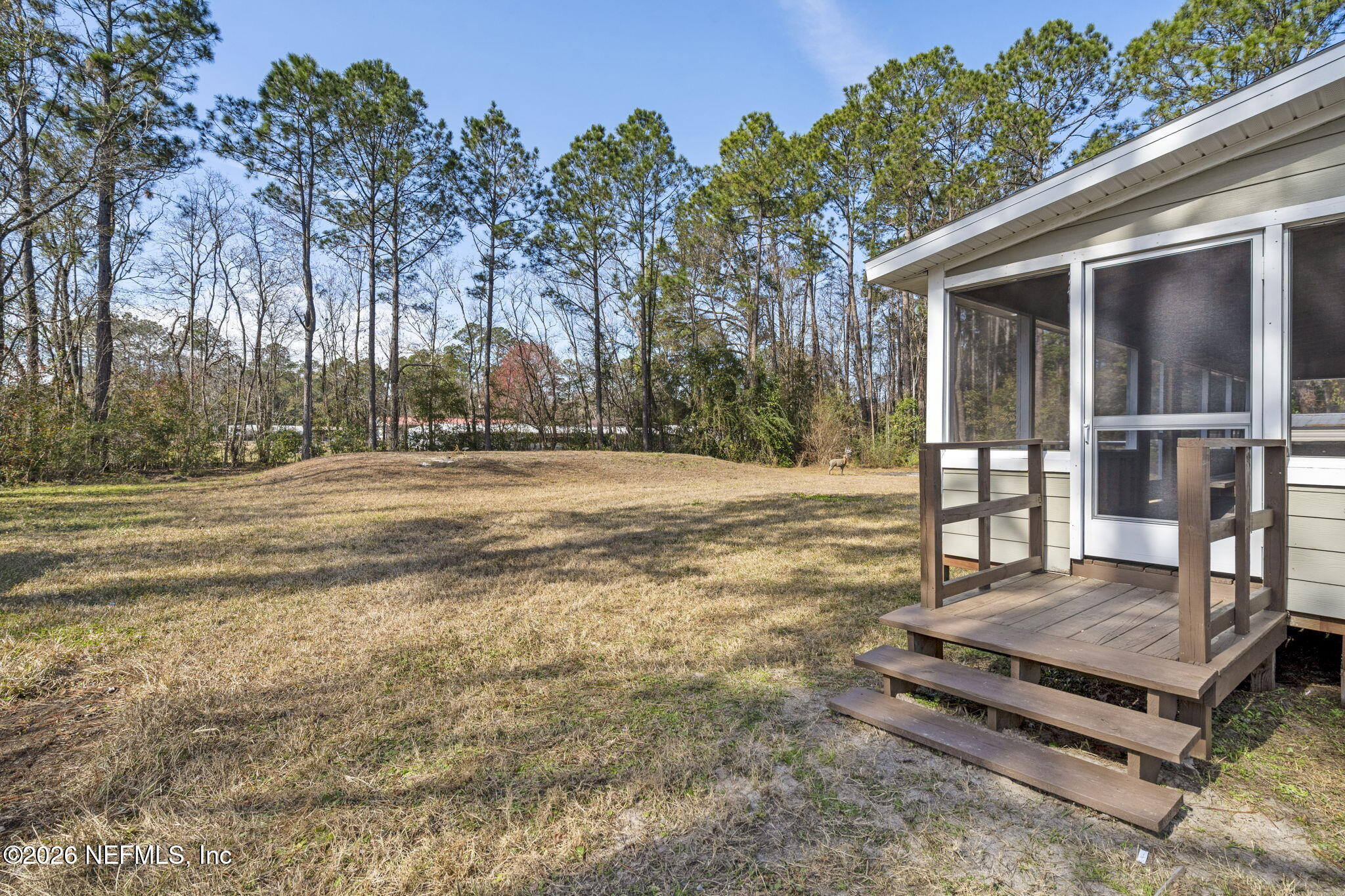 540605 Lem Turner Road Callahan, FL 32011 - Photo 25 of 31 a view of a backyard with a garden and trees