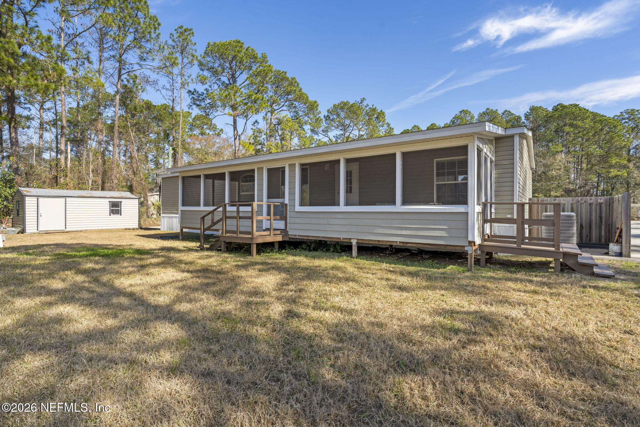 540605 Lem Turner Road Callahan, FL 32011 - Photo 26 of 31 a view of a house with a backyard