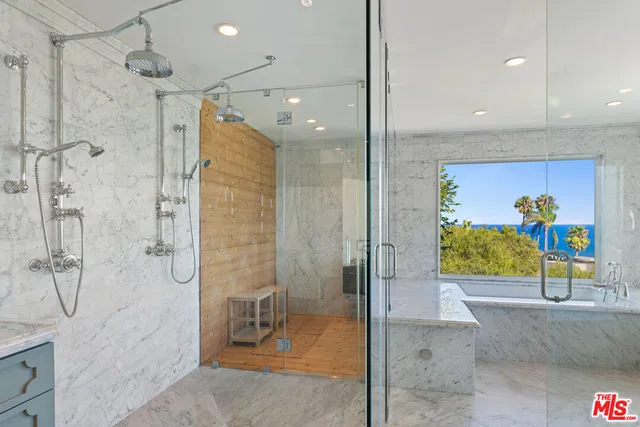 a view of kitchen with furniture and refrigerator