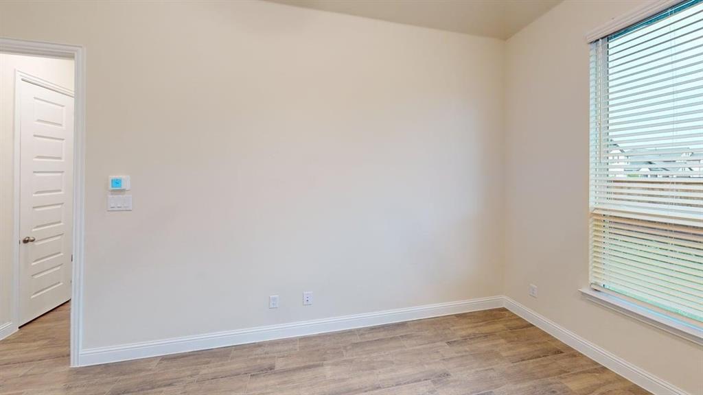 3314 Willena Road Melissa, TX 75454 - Photo 9 of 24 Wood-finish flooring with white trim and a window with blinds