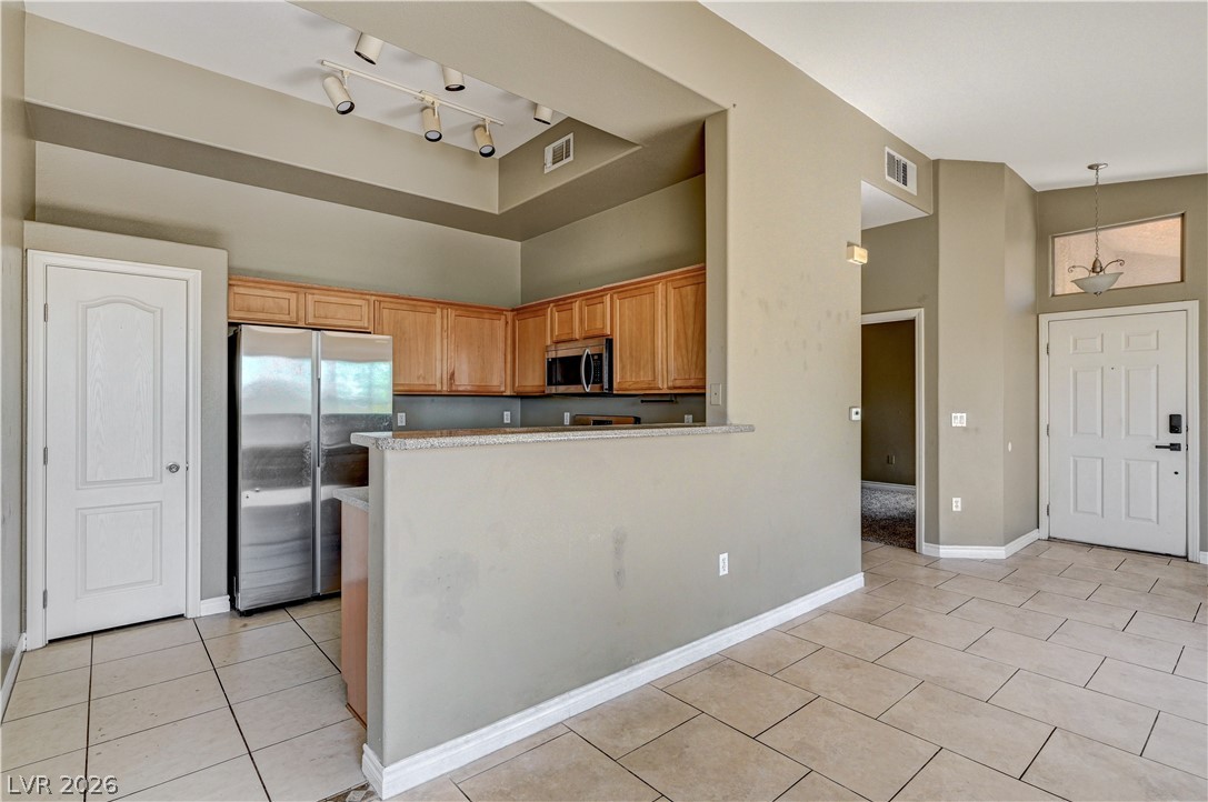8985 South Durango Drive, Unit 2187 Las Vegas, NV 89113 - Photo 1 of 73 A well-appointed kitchen features ample cabinetry and integrated appliances, perfect for entertaining.