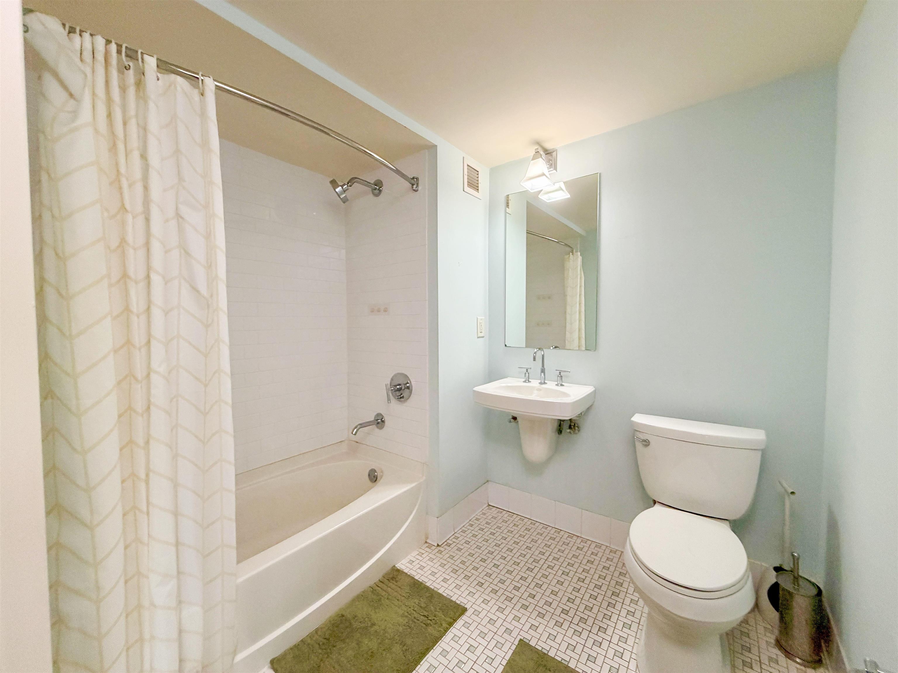 700 Grove Street, Unit 4F Jersey City, NJ 07310 - Photo 15 of 30 a bathroom with a toilet and a shower