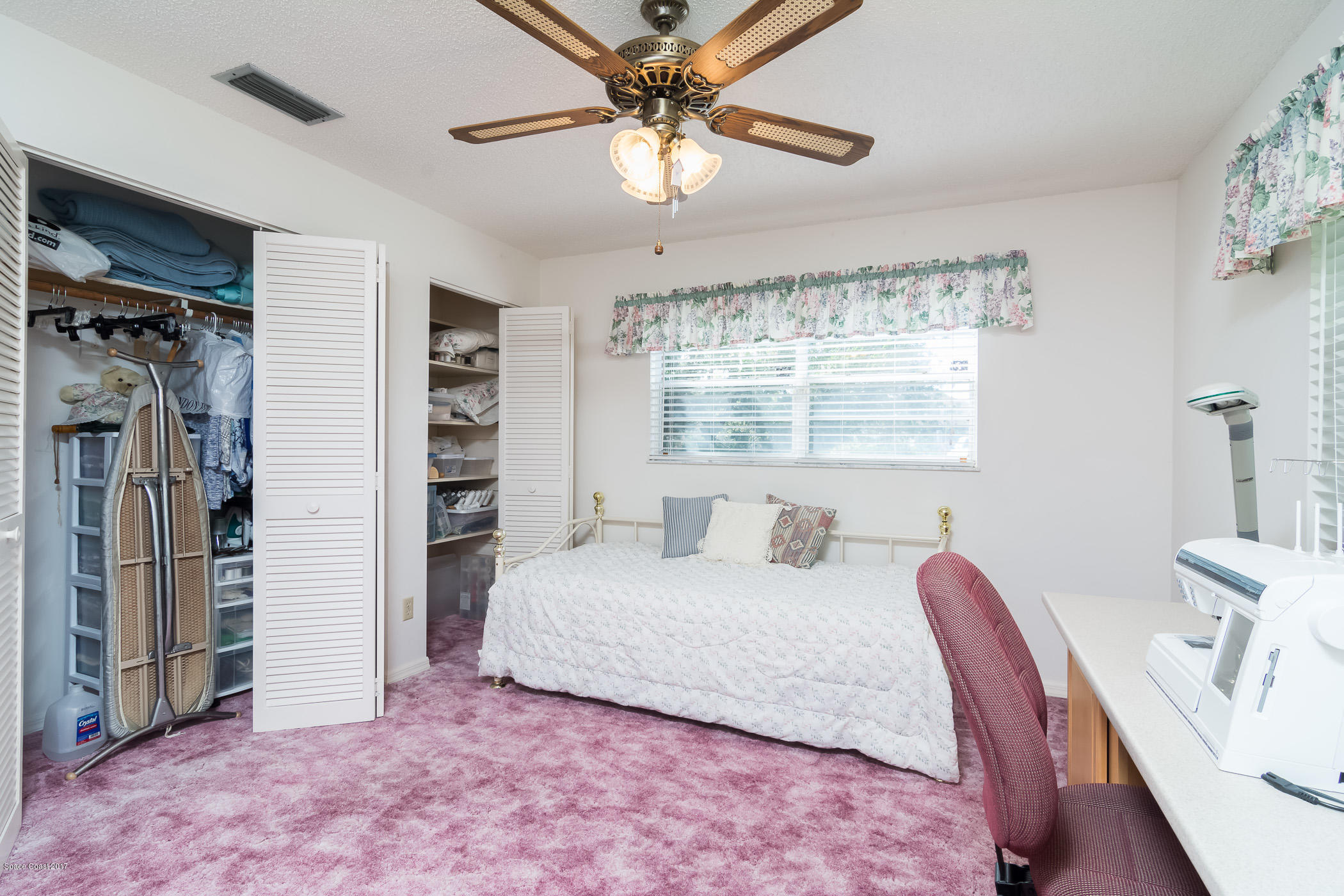 2660 Rocky Point Road Malabar, FL 32950 - Photo 29 of 71 Bedroom 2 w/Closet & Built-in Shelving