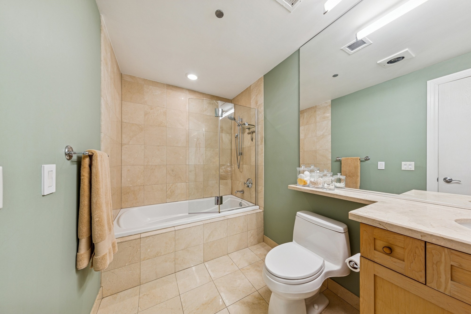 333 North Canal Street, Unit 2505 Chicago, IL 60606 - Photo 11 of 17 a bathroom with a granite countertop toilet a sink and a bathtub