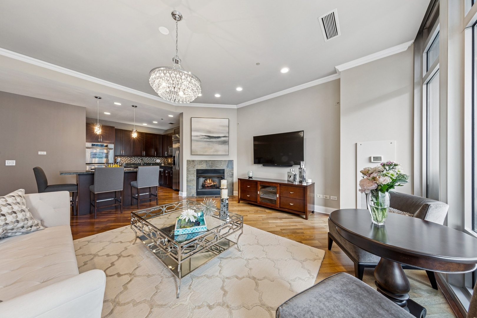 333 North Canal Street, Unit 2505 Chicago, IL 60606 - Photo 4 of 17 a living room with fireplace furniture and a flat screen tv