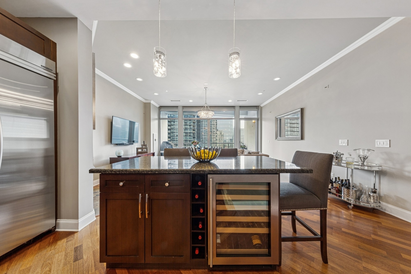 333 North Canal Street, Unit 2505 Chicago, IL 60606 - Photo 8 of 17 a view of a dining room with furniture and wooden floor