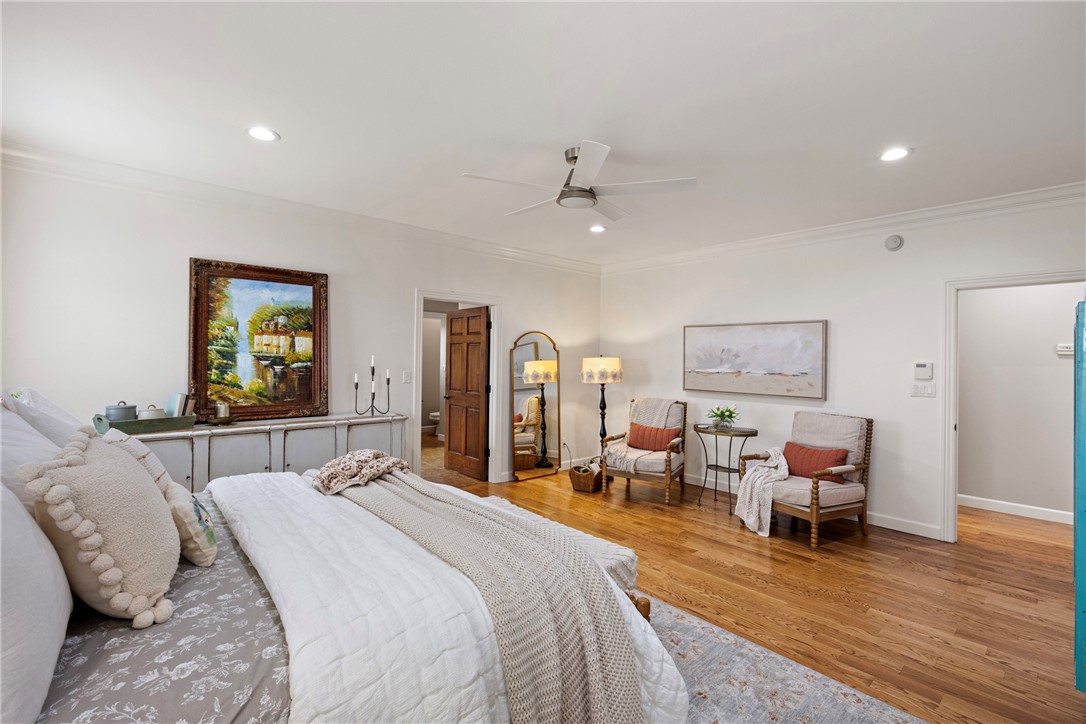 788 Cliff Road Russellville, AR 72802 - Photo 22 of 60 Bedroom featuring ornamental molding, wood finished floors, a ceiling fan, and recessed lighting