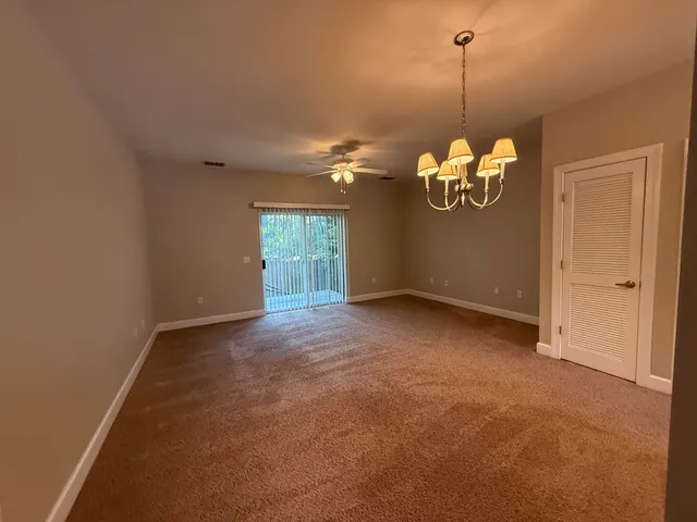 a view of a room with a chandelier