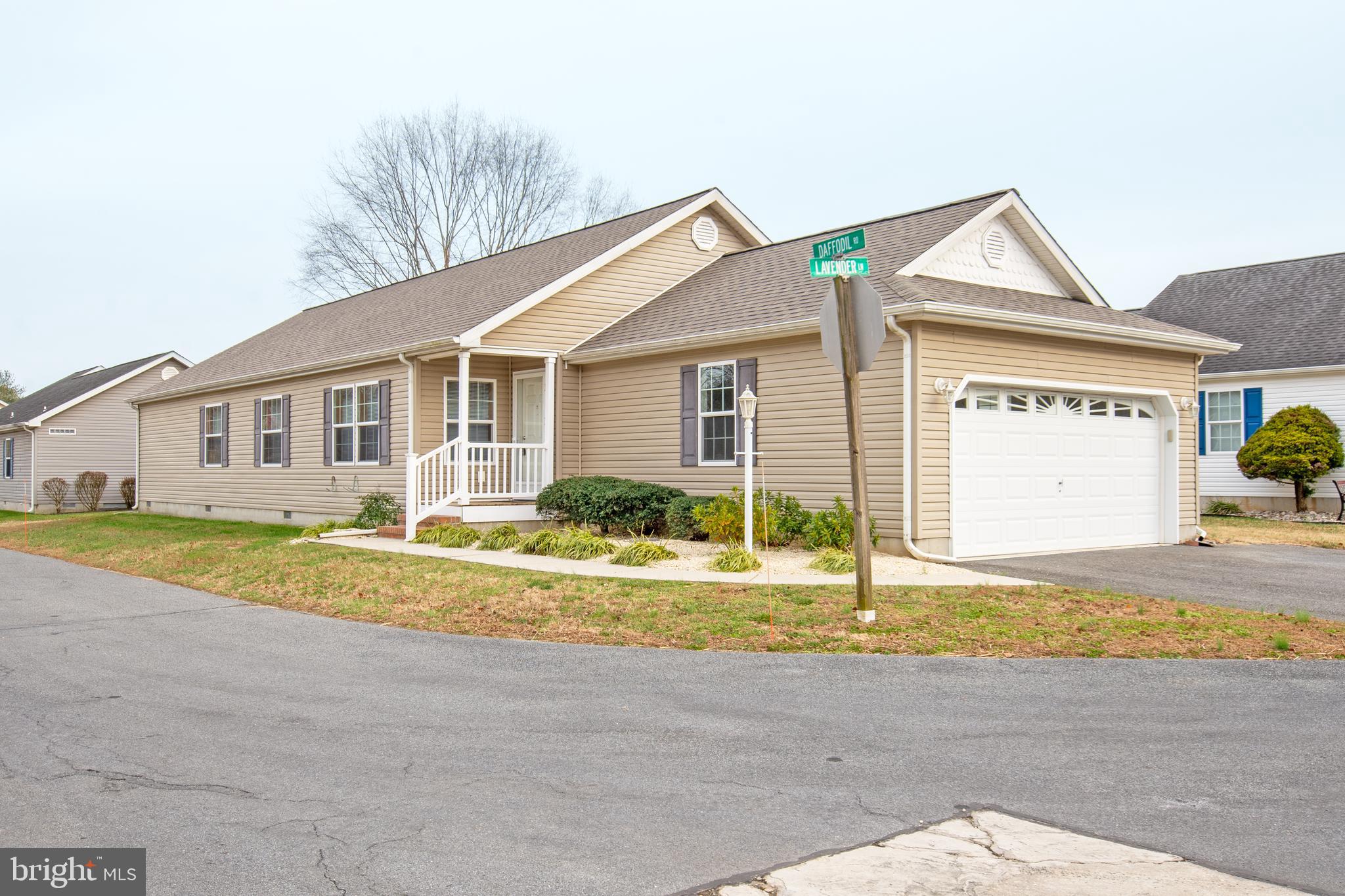 a view of a house with a swimming pool and a yard