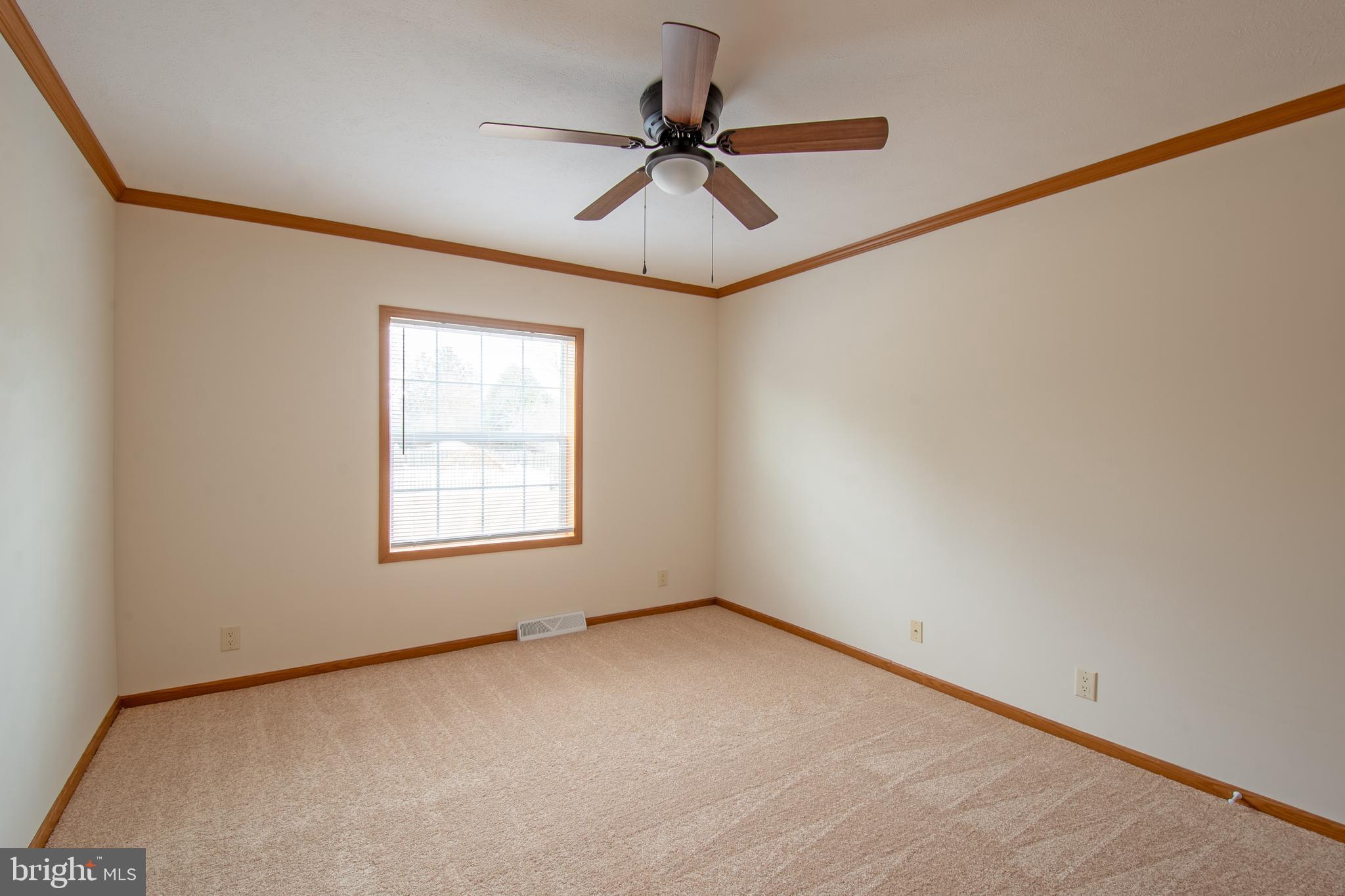 116 Lavender Lane, Unit 4 Magnolia, DE 19962 - Photo 17 of 26 a view of an empty room with a window