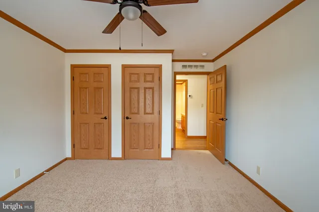 a view of hallway with chandelier