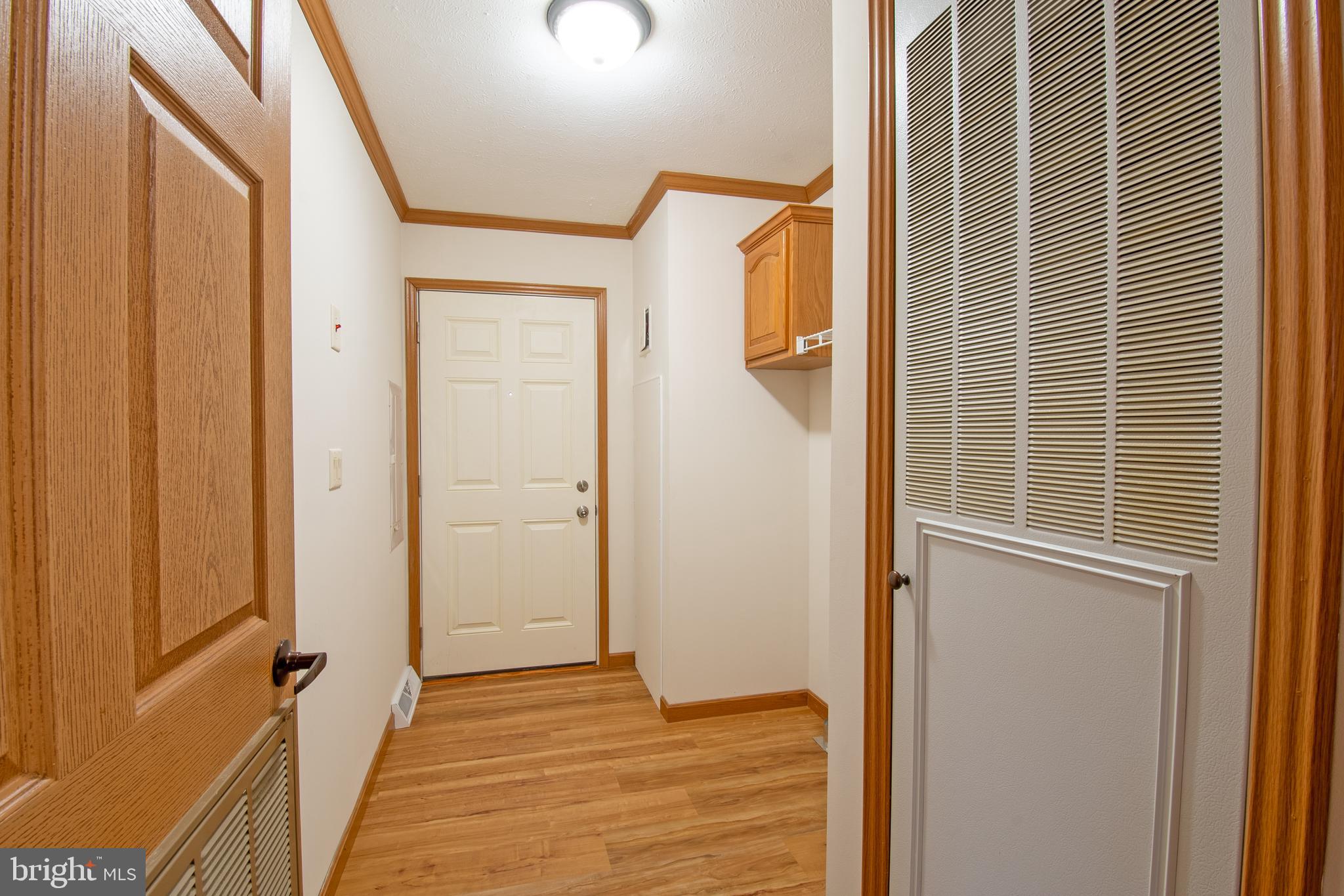 116 Lavender Lane, Unit 4 Magnolia, DE 19962 - Photo 19 of 26 a view of a hallway with wooden floor and staircase