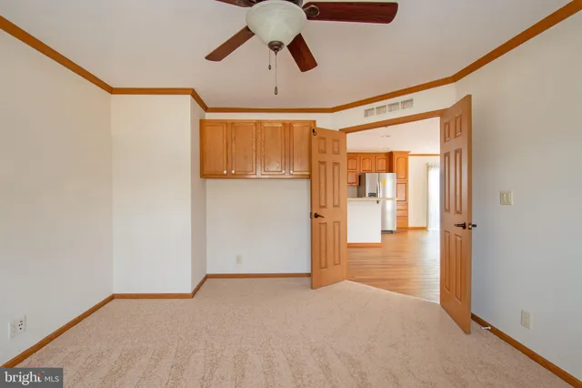 a view of a hallway with a chandelier