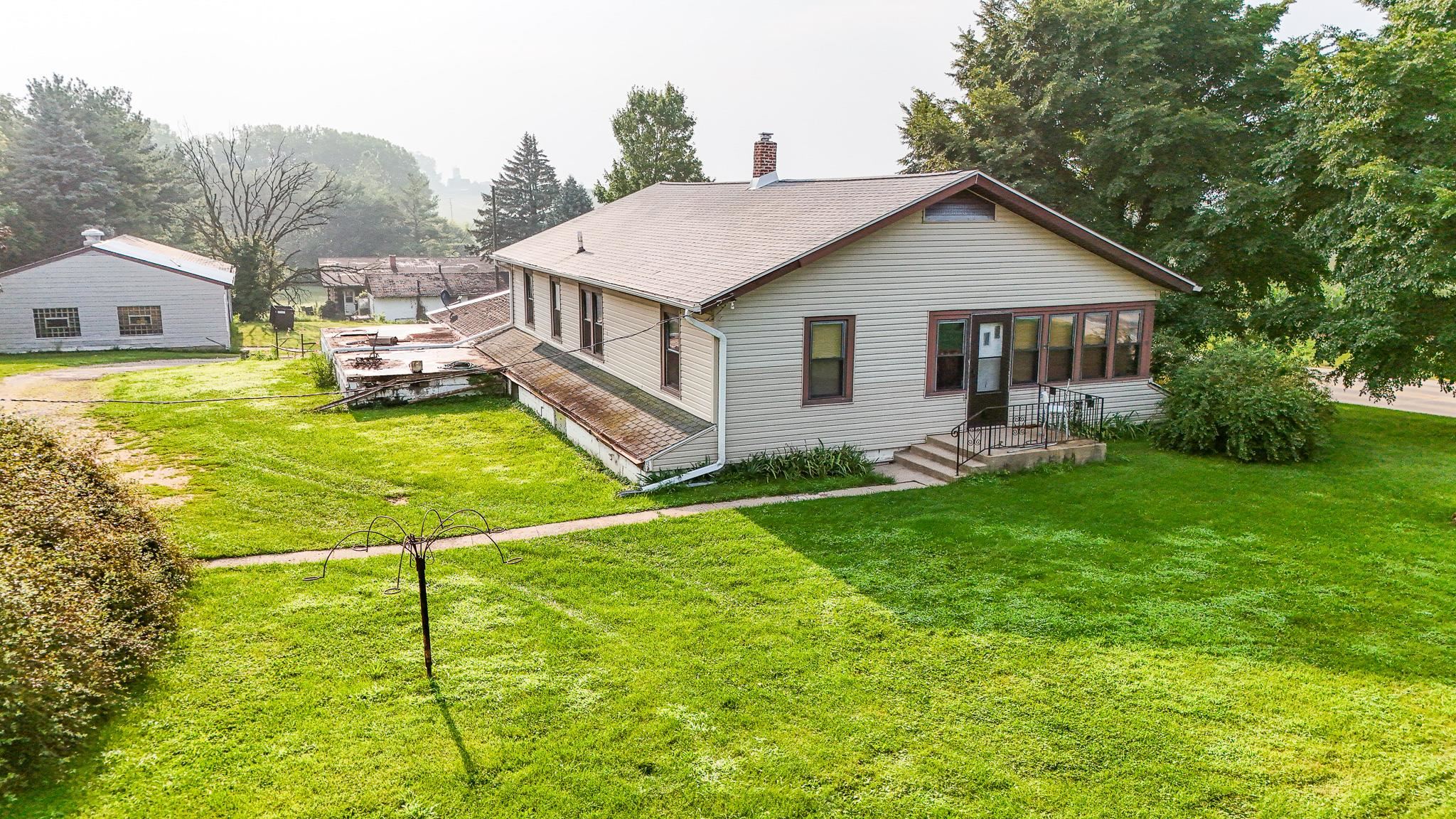 7916 West Pines Road Polo, IL 61064 - Photo 1 of 42 a house view with a garden space