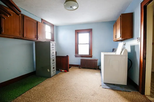 a room with cabinets and a window