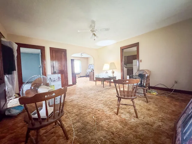 a dining room with furniture and window