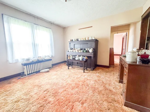 a bedroom with furniture and a window