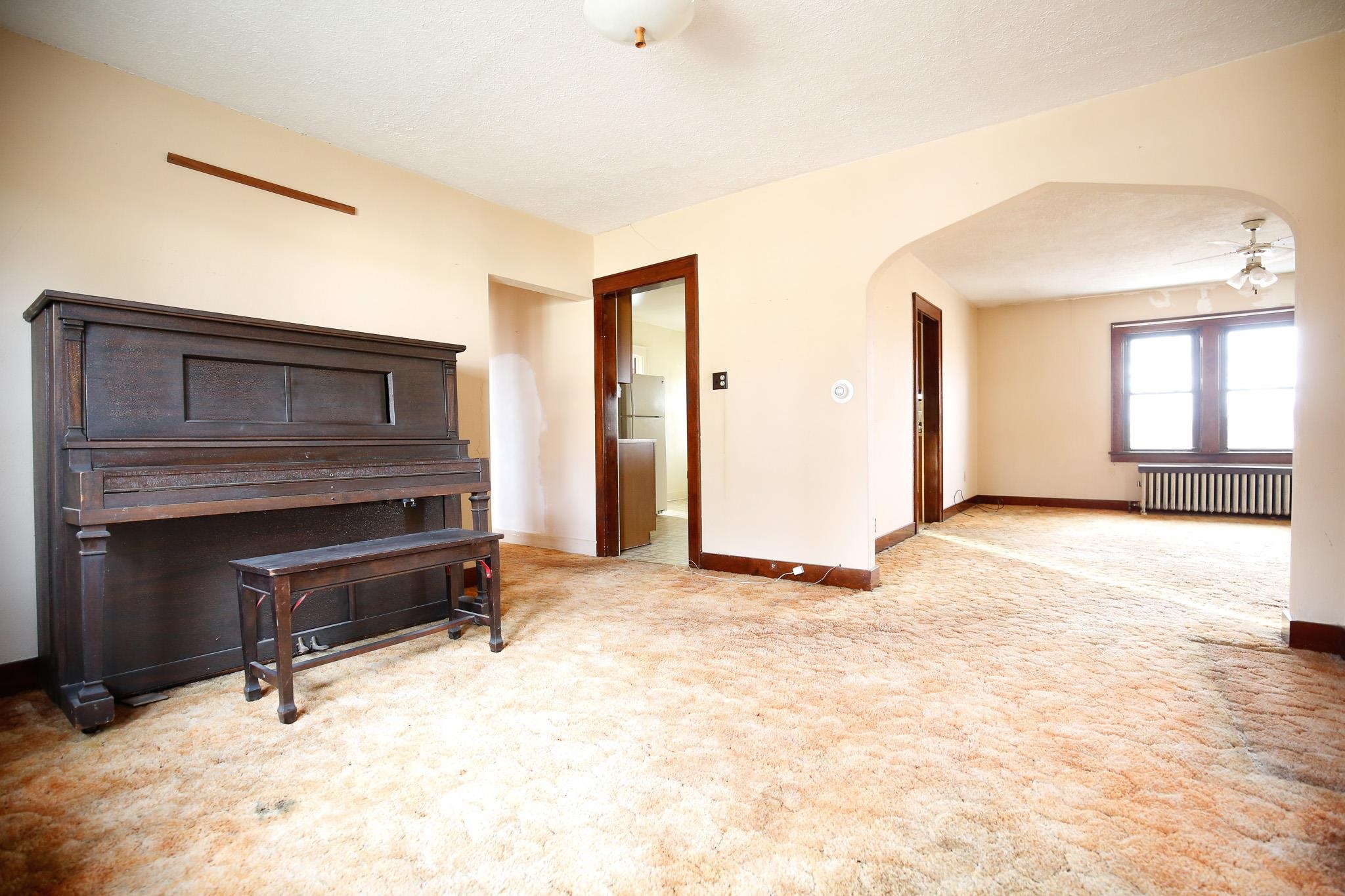 7916 West Pines Road Polo, IL 61064 - Photo 32 of 42 an empty room with a fireplace and a window