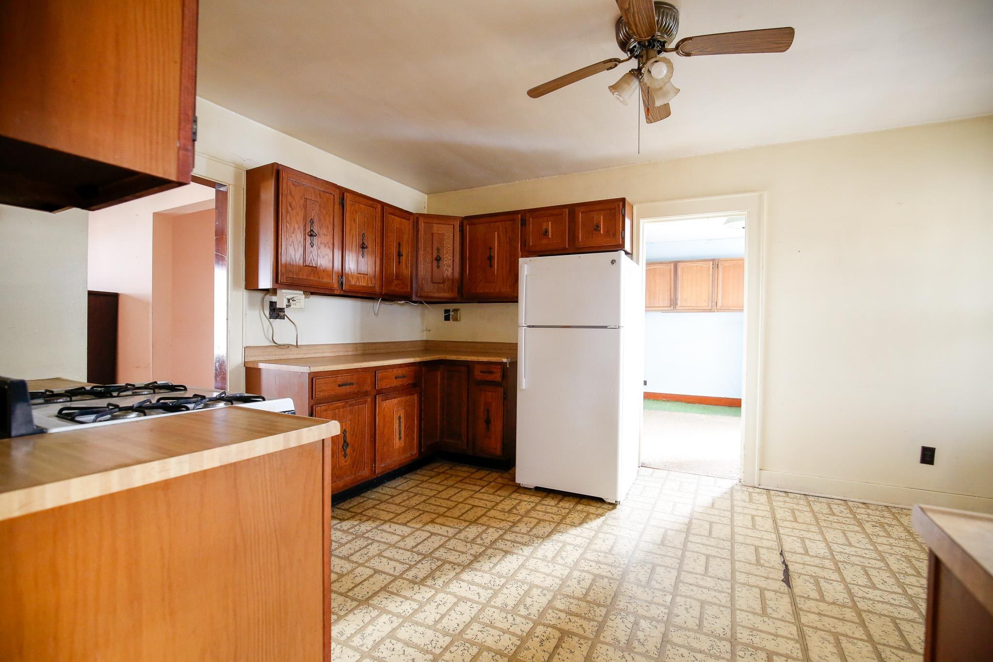 7916 West Pines Road Polo, IL 61064 - Photo 35 of 42 a kitchen with a sink a stove and refrigerator