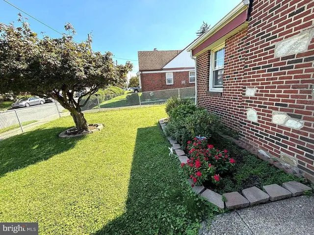 a house with garden in front of it