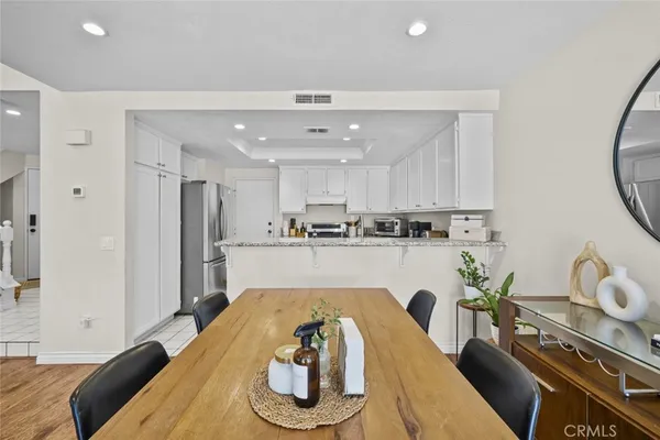 a living room with kitchen island furniture and a table