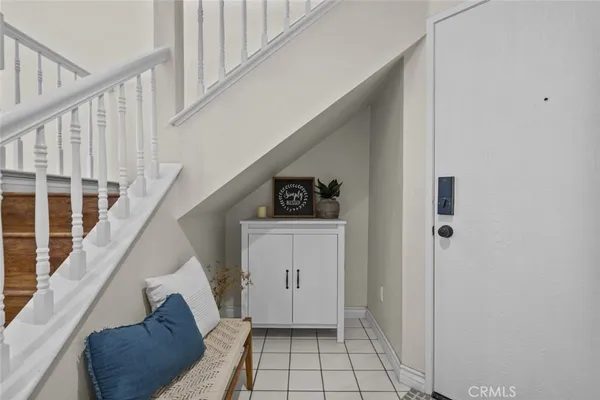 a view of entryway with stairs and a rug