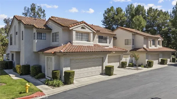 a front view of a house with garage