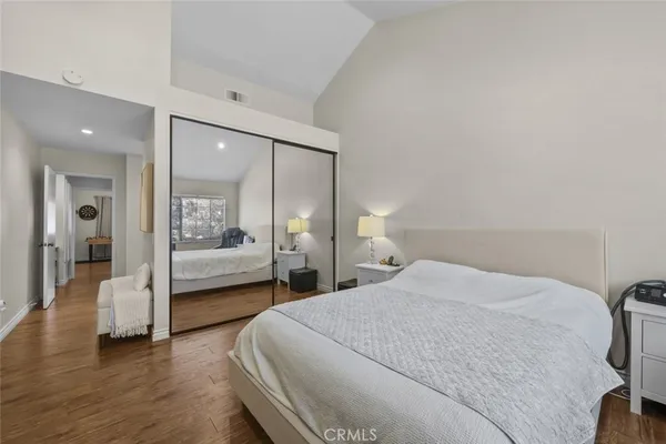 a bedroom with a bed and a view of bedroom