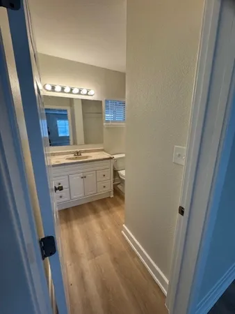 a bathroom with a double vanity sink and a mirror