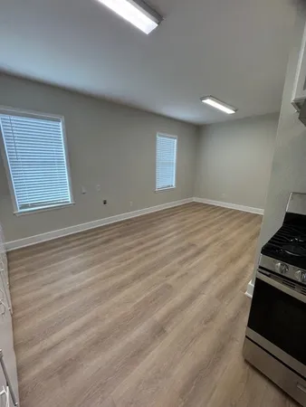 an empty room with wooden floor