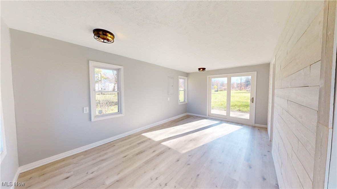 15245 Georgia Road Middlefield, OH 44062 - Photo 17 of 35 Empty room featuring light wood-type flooring