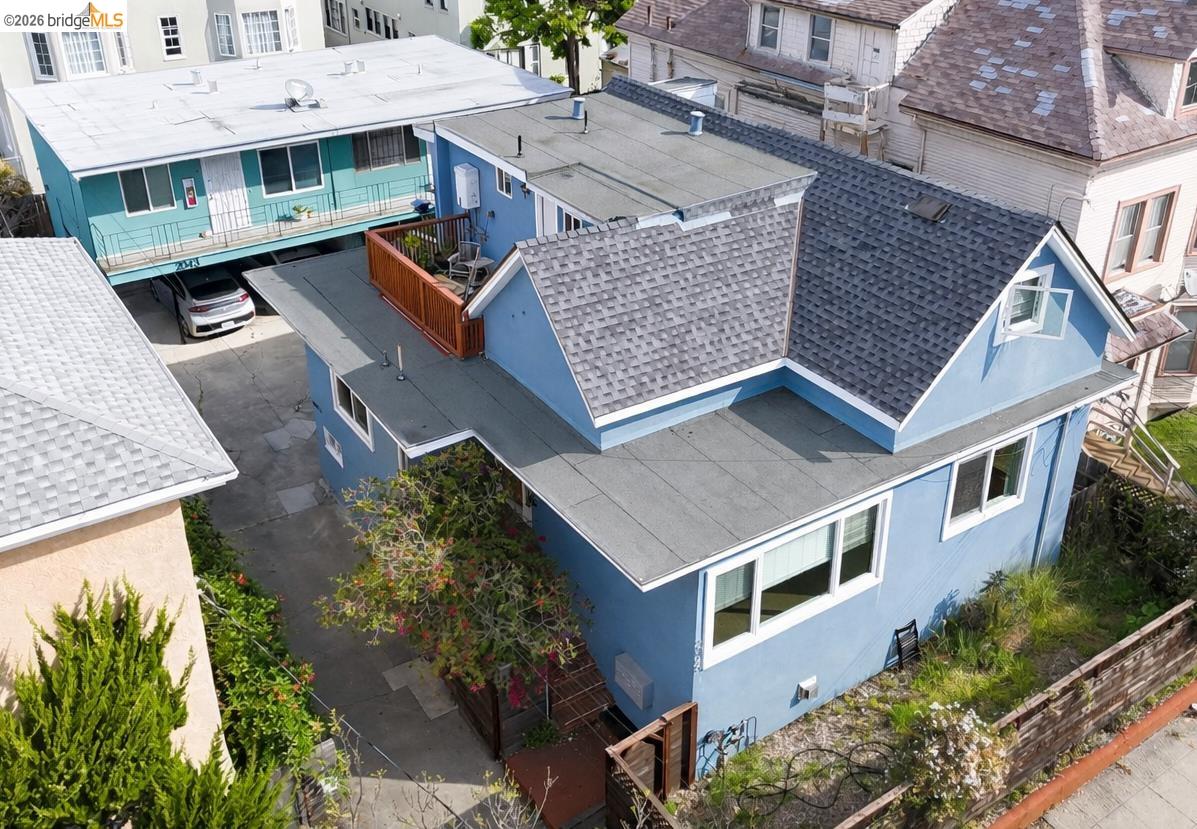 an aerial view of residential houses with outdoor space