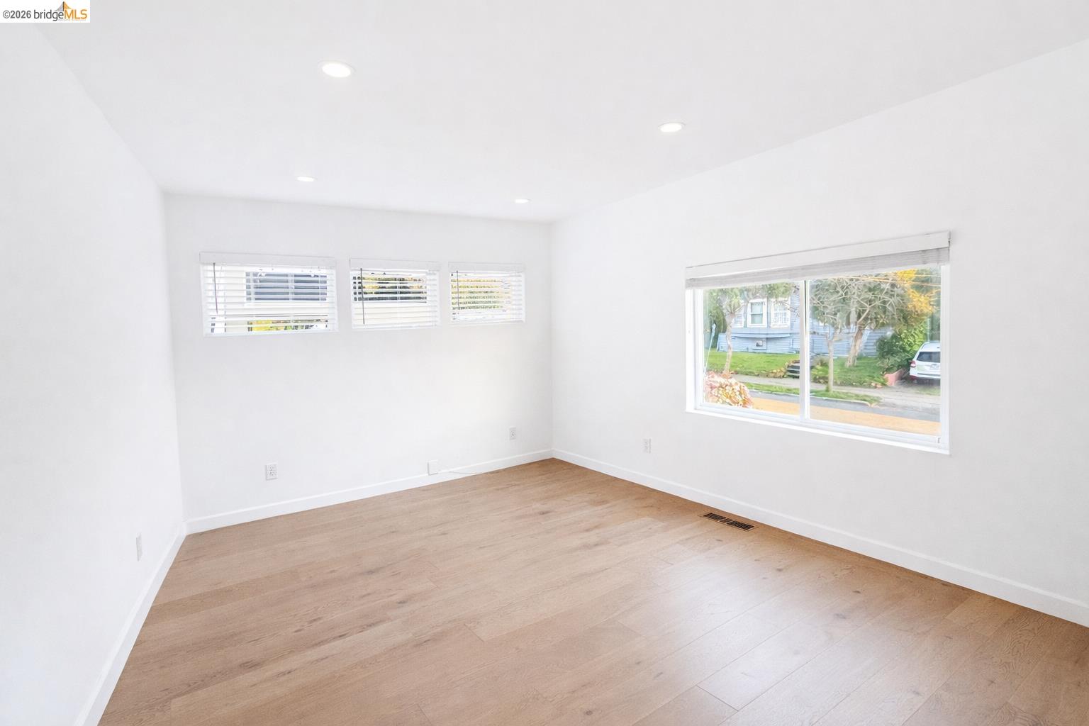 2045 Emerson Street Berkeley, CA 94703 - Photo 11 of 19 an empty room with windows