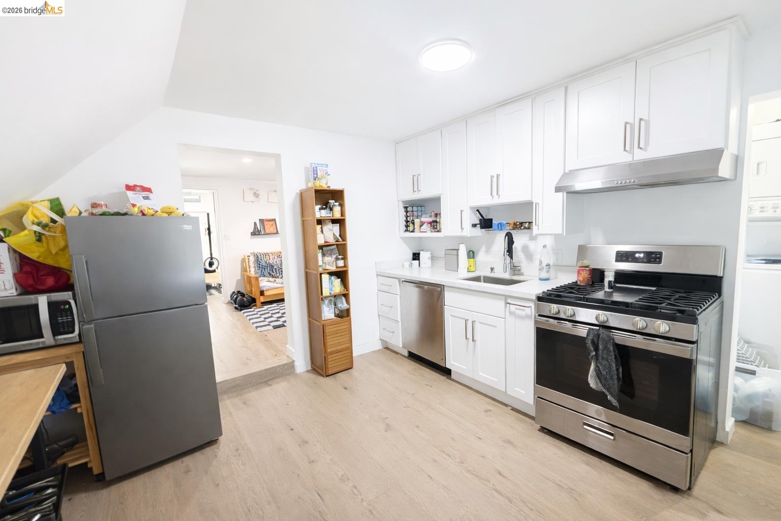 2045 Emerson Street Berkeley, CA 94703 - Photo 13 of 19 a kitchen with a refrigerator sink stove and cabinets