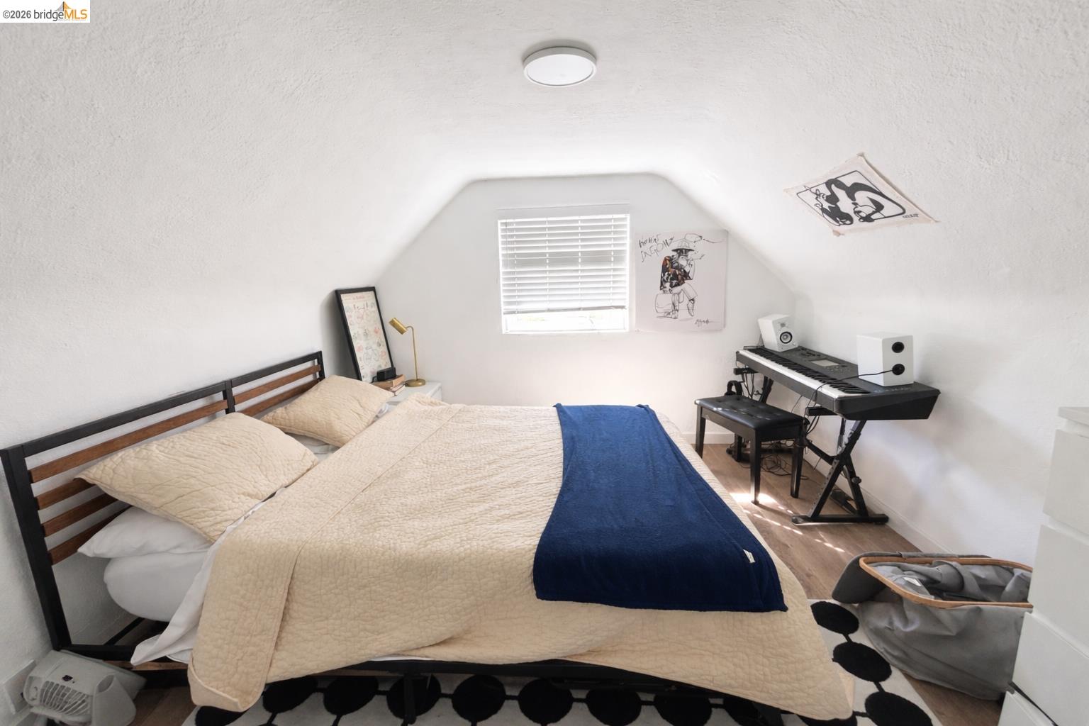2045 Emerson Street Berkeley, CA 94703 - Photo 14 of 19 a bedroom with a bed and a night stand