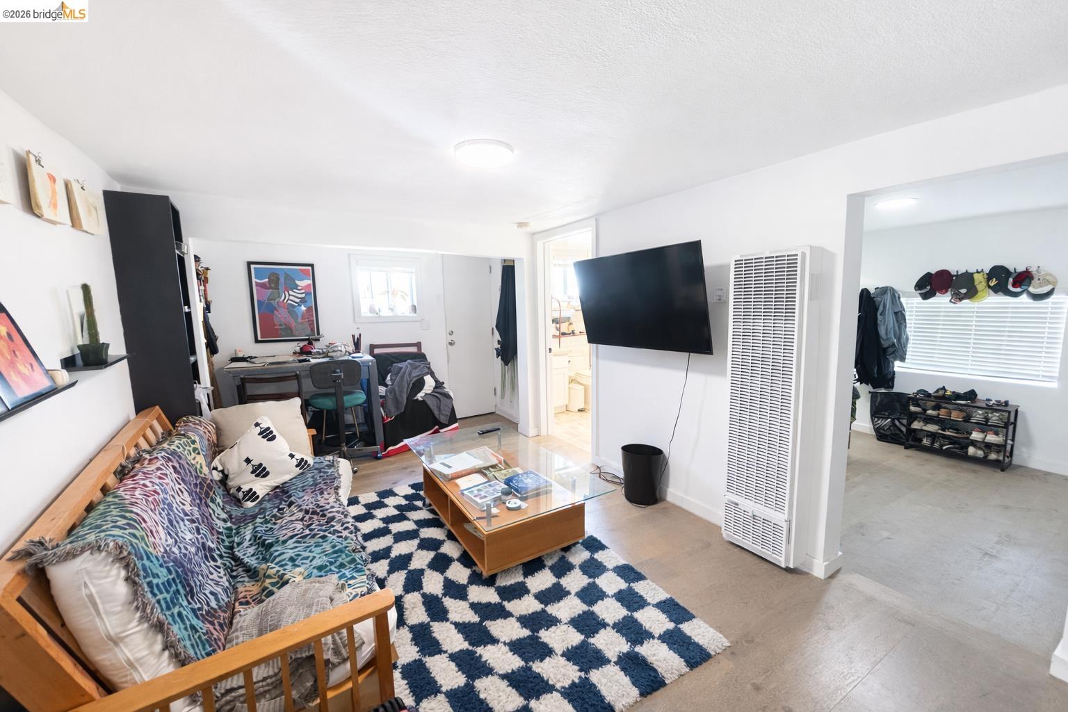2045 Emerson Street Berkeley, CA 94703 - Photo 15 of 19 a living room with furniture and a flat screen tv