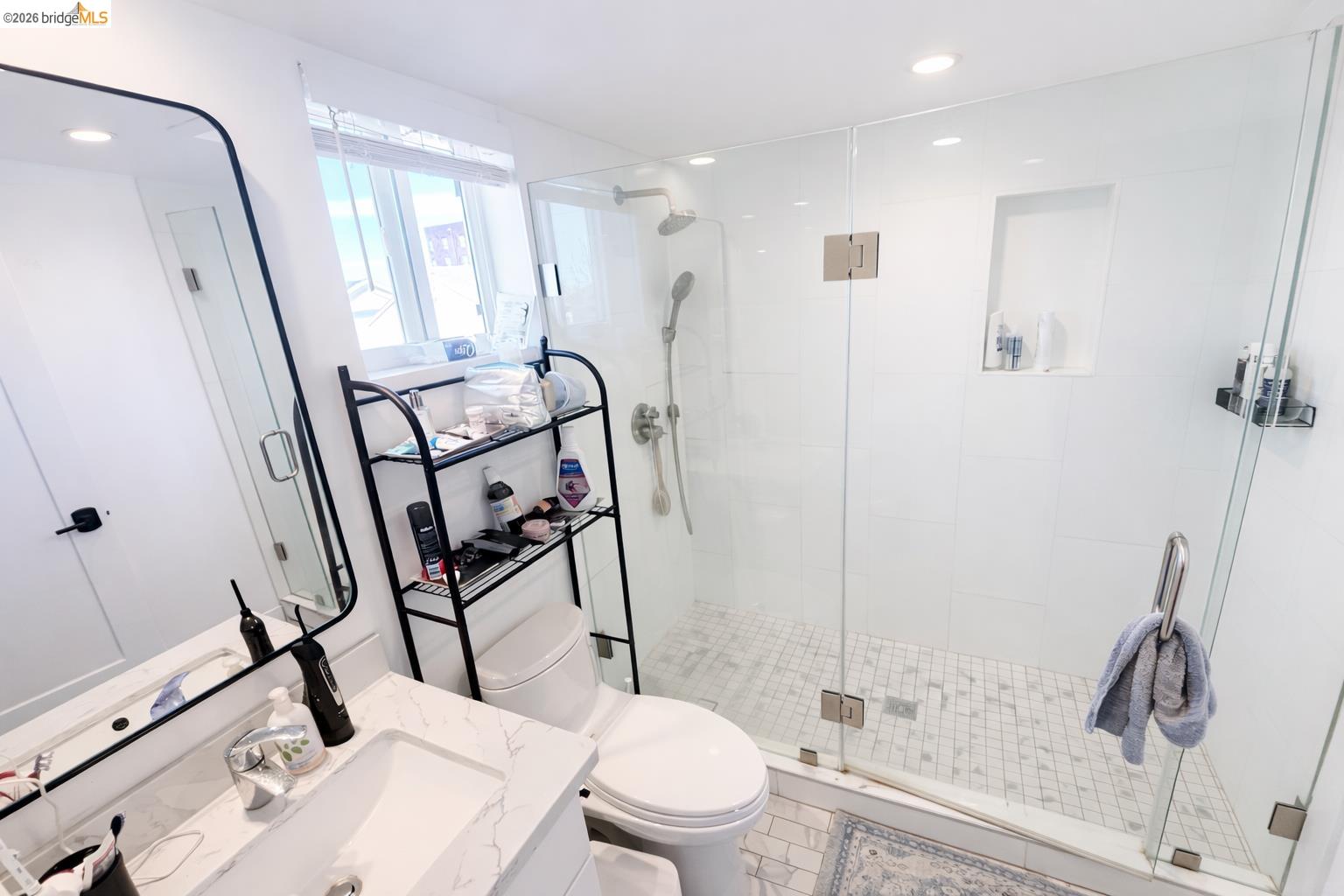 2045 Emerson Street Berkeley, CA 94703 - Photo 16 of 19 a bathroom with a sink toilet and shower