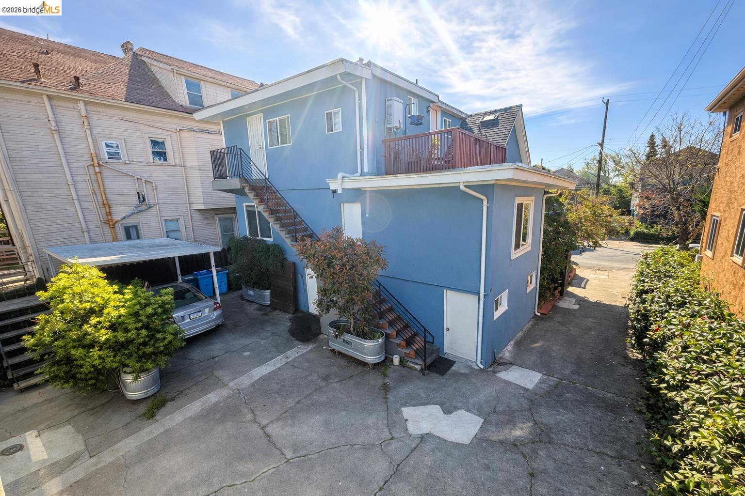 2045 Emerson Street Berkeley, CA 94703 - Photo 5 of 19 a view of a house with a yard and potted plants