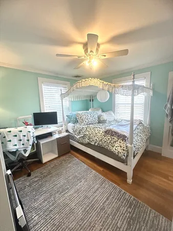 a bedroom with a bed and window
