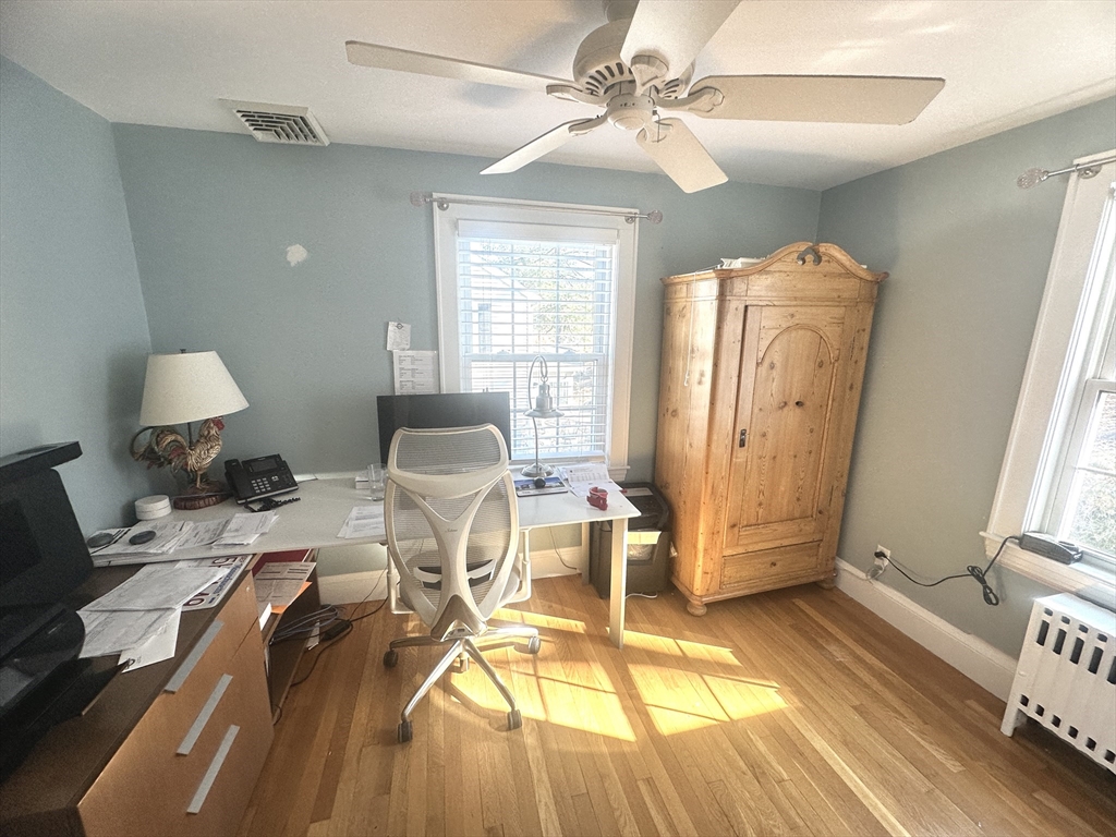 164 Florence Road Waltham, MA 02453 - Photo 15 of 19 a living room with furniture a table and wooden floor