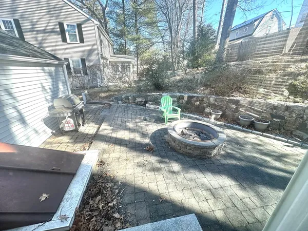 a view of a chairs and table in backyard