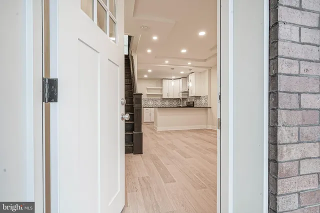 a view of a kitchen from the hallway