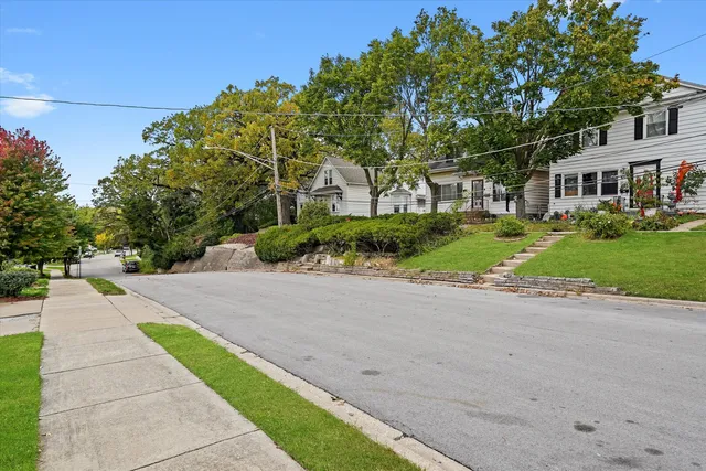 a view of a street with a building in the background